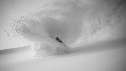 Snowboarder in deep powder European Alps winter 25/26 – Behind The Pines