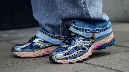 saucony progrid omni 9 on foot behind the pines lifestyle shot