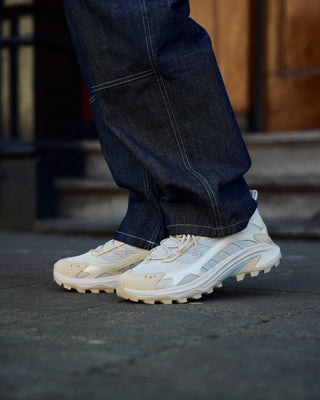 Merrell Moab Speed 2 Vent 2k Se Eggshell lifestyle shot behind the pines