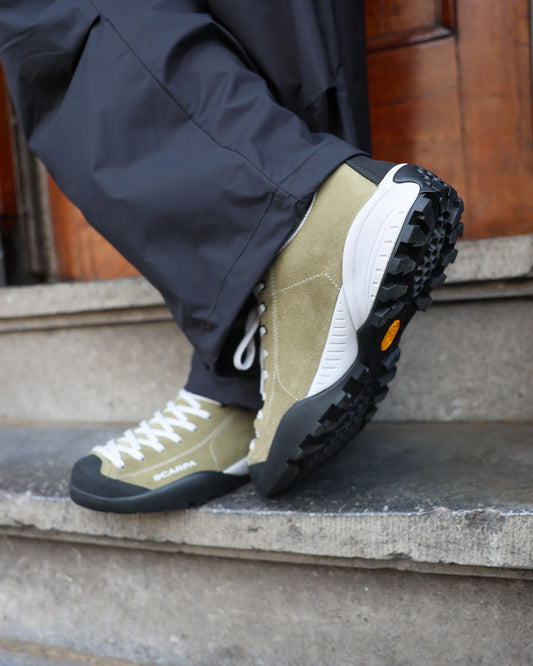 Scarpa Mojito Sage standing on a ledge detail 2